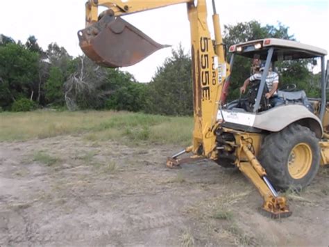 How to Operate a Backhoe : How to Operate the Back Boom on .